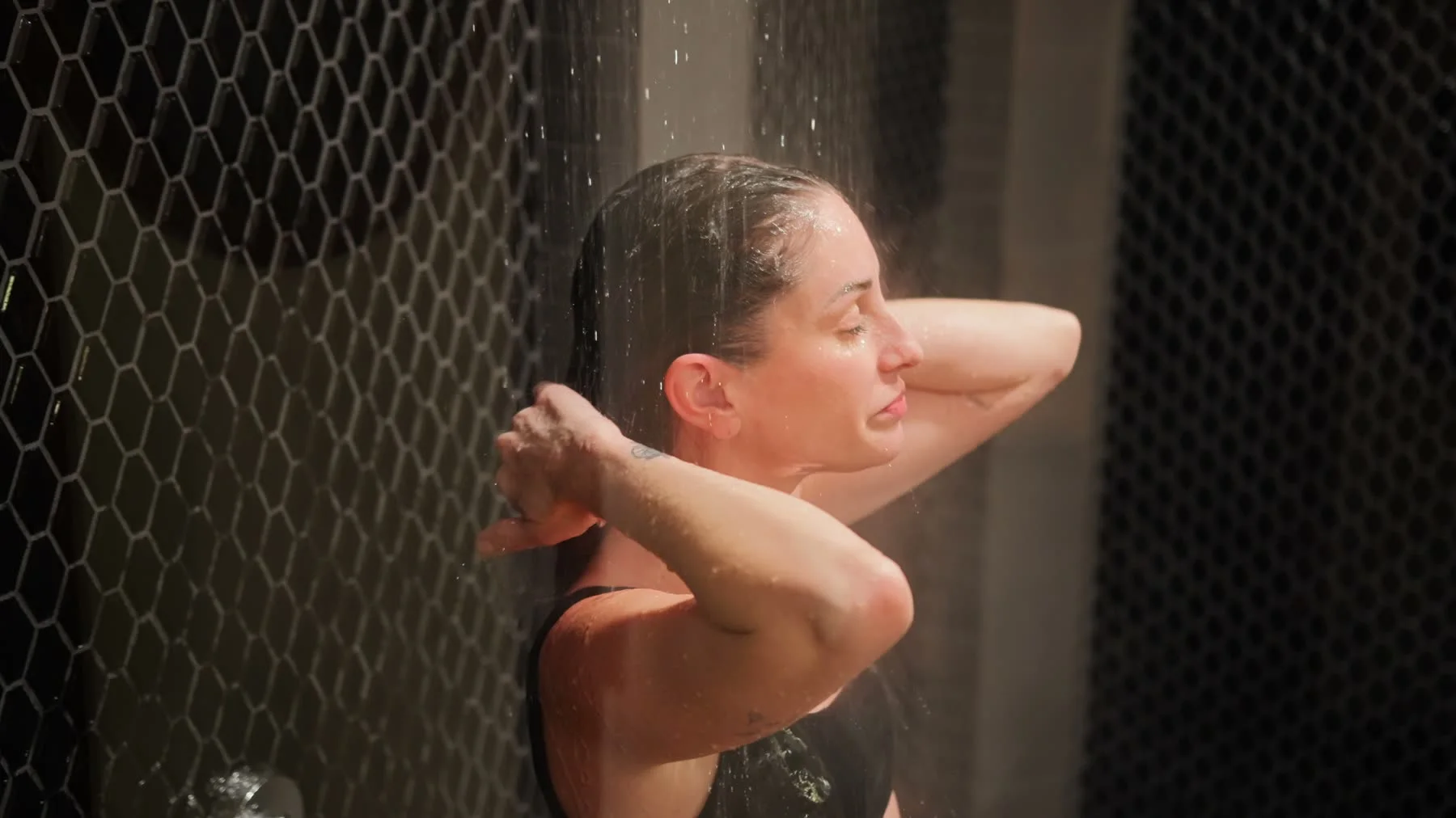 Guest using the thermal shower in the finished Cleopatra's Rituals launch video.