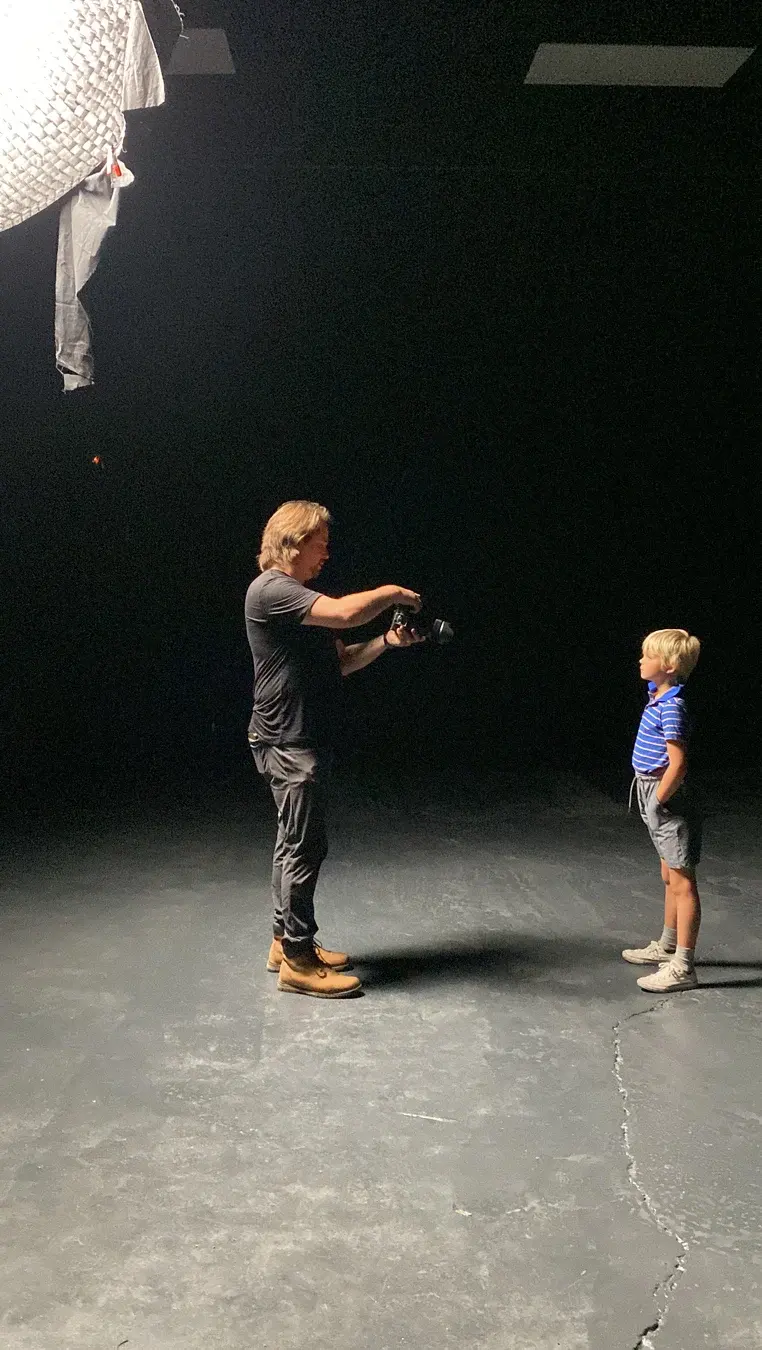 James Alton directing young Dave in a black studio setup for Three Hearts.